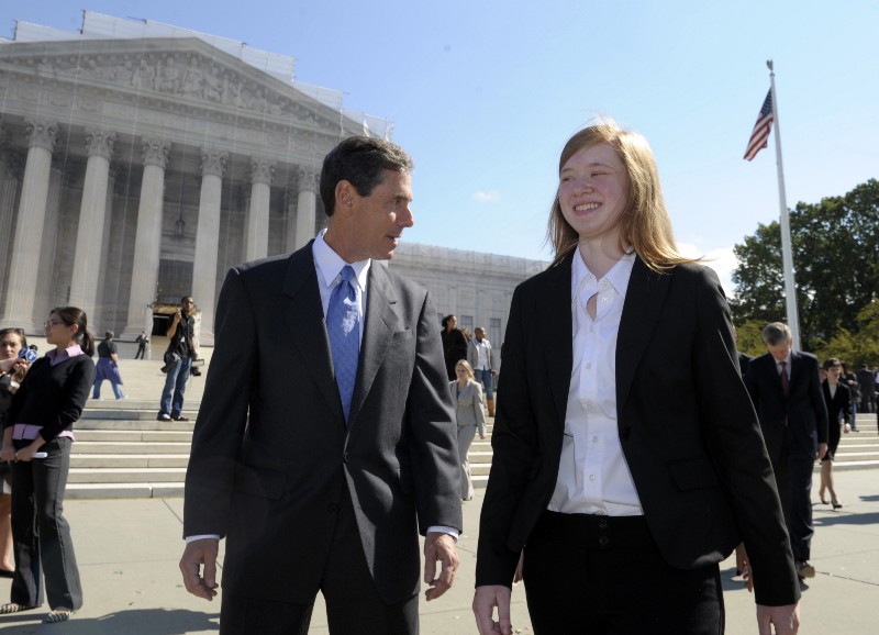 Abigail Fisher, the Texan involved in the University of Texas affirmative action case, and Edward Blum, who runs a group working to end affirmative action, walk outside the Supreme Court in Washington, Wednesday, Oct. 10, 2012. CREDIT: SUSAN WALSH, AP