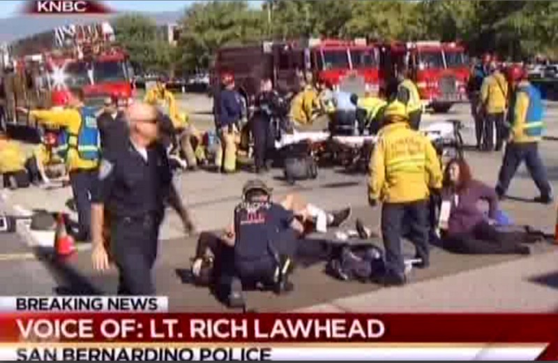 First responders attend to people outside a Southern California social services center in San Bernardino, where one or more gunmen opened fire, shooting multiple people on Wednesday, Dec. 2, 2015. CREDIT: KNBC VIA AP