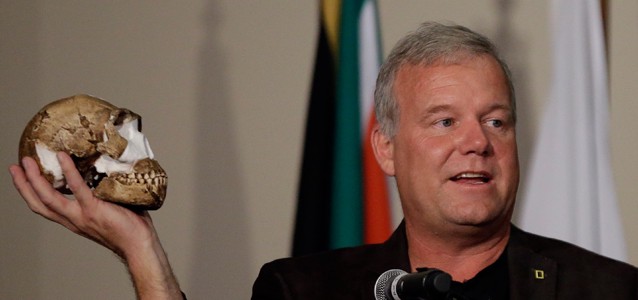 Lee Berger, a paleoanthropologist at the University of Witwatersrand, holds a reconstruction of the skull of Homo naledi, a new addition to the human family tree. Alternate species name: “Poor Yorick.” CREDIT: AP/Themba Hadebe