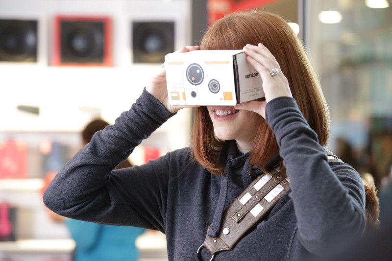 A woman looks through a Star Wars-themed Google Cardboard viewer CREDIT: JEAN-MARC GIBOUX/ AP IMAGES FOR VERIZON