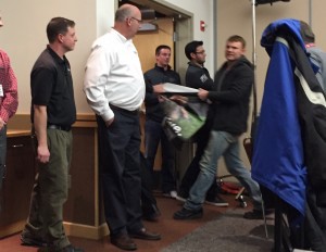 Matt Johnson, an organizer with the group Direct Action Everywhere, is escorted out of Carly Fiorina’s event with pork farmers. CREDIT: Emily Atkin