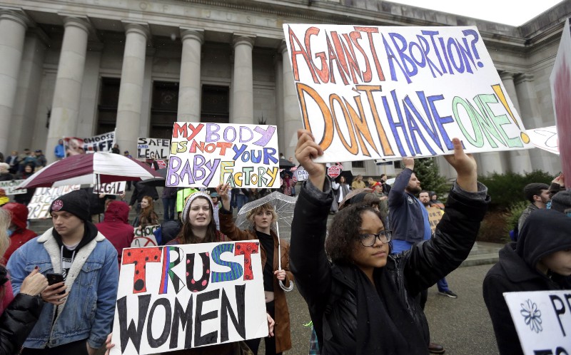 Protestors supporting abortion rights demonstrate Tuesday, Jan. 19, 2016, during an anti-abortion protest at the Capitol in Olympia, Wash. CREDIT: AP PHOTO/TED S. WARREN