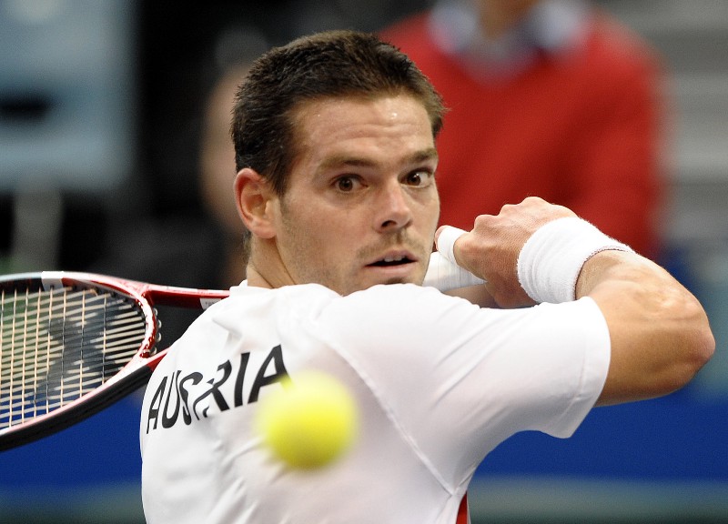 Daniel Koellerer of Austria returns the ball to Lukas Lacko of Slovakia. Koellerer lost his appeal against a life ban for match-fixing at world sport’s highest court on Friday March 23, 2012. CREDIT: HANS PUNZ, AP