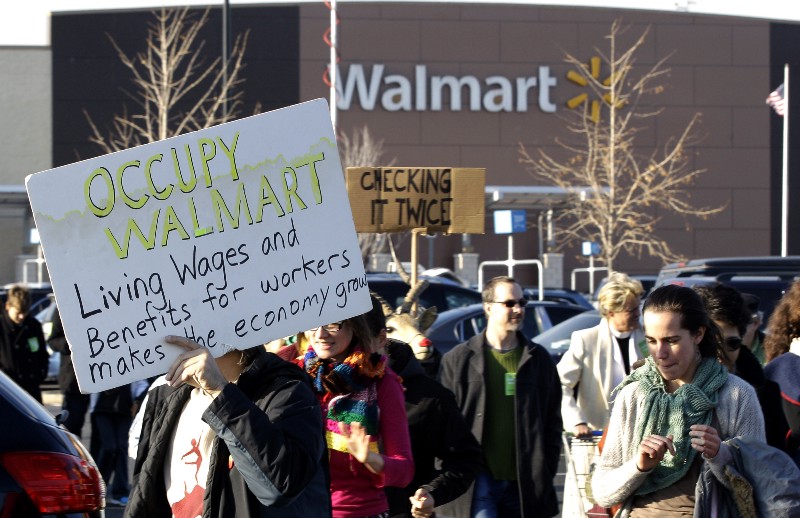 People protest against Wal-Mart on Black Friday, Nov 23, 2012, in Secaucus, N.J. CREDIT: AP PHOTO/MEL EVANS