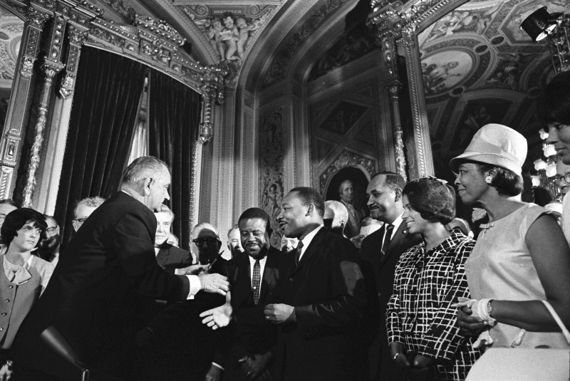 President Lyndon Johnson presents Martin Luther King, Jr. with a pen used to sign the Voting Rights Act CREDIT: LBJ LIBRARY PHOTO BY YOICHI OKAMOTO