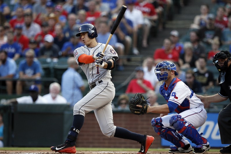 Houston Astros shortstop follows through on a swing CREDIT: AP PHOTO/TONY GUTIERREZ