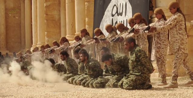 Children are shown executing a group of captives in an ISIS video shot in the ancient city of Palmyra, Syria. CREDIT: YOUTUBE