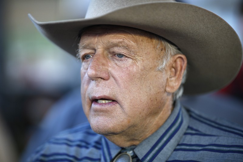 Rancher Cliven Bundy speaks with supporters at an event Saturday, April 11, 2015, in Bunkerville, Nev. Bundy was holding the event to celebrate the one year anniversary since the Bureau of Land Management’s failed attempt to collect his cattle.(AP Photo/John Locher) CREDIT: AP PHOTO/JOHN LOCHER