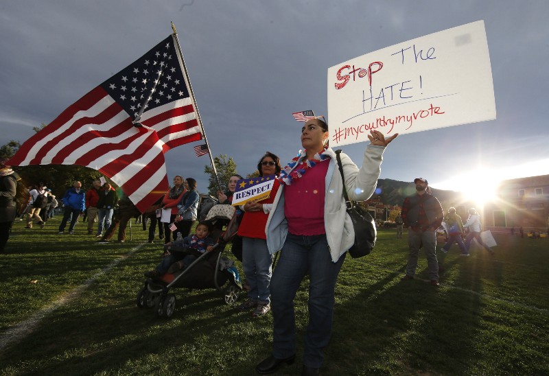 Ganovana Ayala of Boulder, Colo., holds a sign while attending a Latino voting rally on the campus of the University of Colorado before the Republican presidential debate Wednesday, Oct. 28, 2015, in Boulder, Colo. (AP Photo/David Zalubowski) CREDIT: AP PHOTO/DAVID ZALUBOWSKI