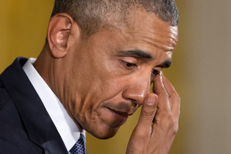 An emotional President Barack Obama pauses to wipe away tears as he recalled the 20 first-graders killed in 2012 at Sandy Hook Elementary School, while speaking in the East Room of the White House in Washington, Tuesday, Jan. 5, 2016, about steps his administration is taking to reduce gun violence. CREDIT: AP PHOTO/JACQUELYN MARTIN