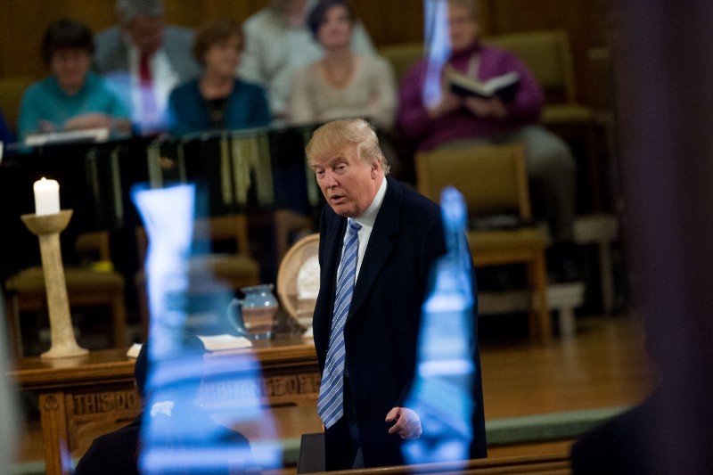 Republican presidential candidate Donald Trump arrives for service at First Presbyterian Church in Muscatine, Iowa, on Sunday. CREDIT: AP PHOTO/ANDREW HARNIK