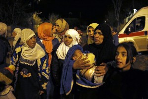 People wait to leave the besieged town of Madaya, northwest of Damascus, Syria. Aid convoys reached three besieged villages on Monday Madaya, near Damascus on Monday, Jan. 11, 2016. CREDIT: AP Photo