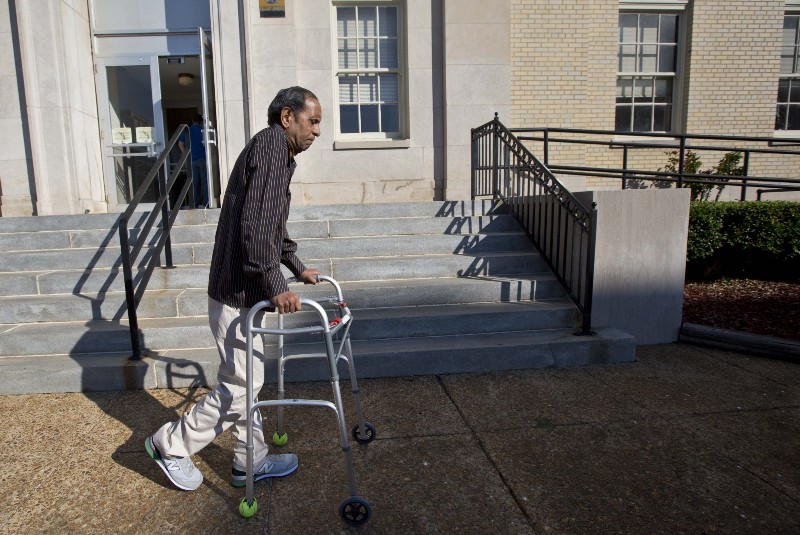 Sureshbhai Patel steadies himself with a walker as he arrives at the federal courthouse before start of a trial against Madison, Ala., police officer Eric Sloan Parker, Tuesday, Sept. 1, 2015, in Huntsville, Ala. Patel, who was visiting relatives from his native India in February, was walking in his son’s neighborhood when police responding to a call about a suspicious person stopped to question him. A police video captured an officer slamming the man to the ground, partially paralyzing him. CREDIT: AP PHOTO/BRYNN ANDERSON