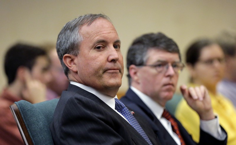 Texas Attorney General Ken Paxton, left, with his chief of staff Bernie McNamee, waits to testify during a committee hearing on Planned Parenthood videos targeting the abortion provider in July 2015. CREDIT: AP PHOTO, ERICÂ GAY