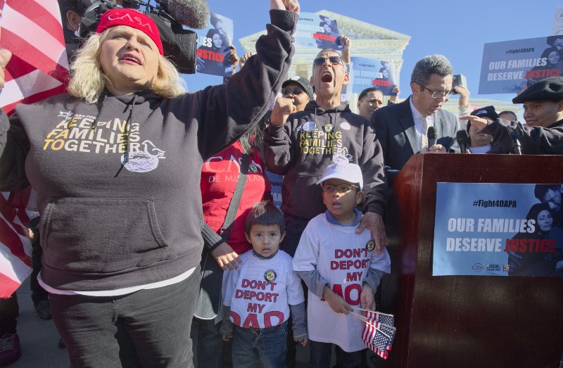 With President Barack Obama’s action running out of time to temporarily protect up to five million unauthorized immigrants from deportation, supporters of the measure to keep families together rally at the Supreme Court in Washington, Friday, Nov. 20, 2015. The Obama administration is asking the Supreme Court for a speedy decision on his policy which allows certain illegal immigrants who entered the country before their 16th birthday and before June 2007 to receive a renewable two-year work permit and exemption from deportation. (AP Photo/J. Scott Applewhite) CREDIT: AP PHOTO/J. SCOTT APPLEWHITE