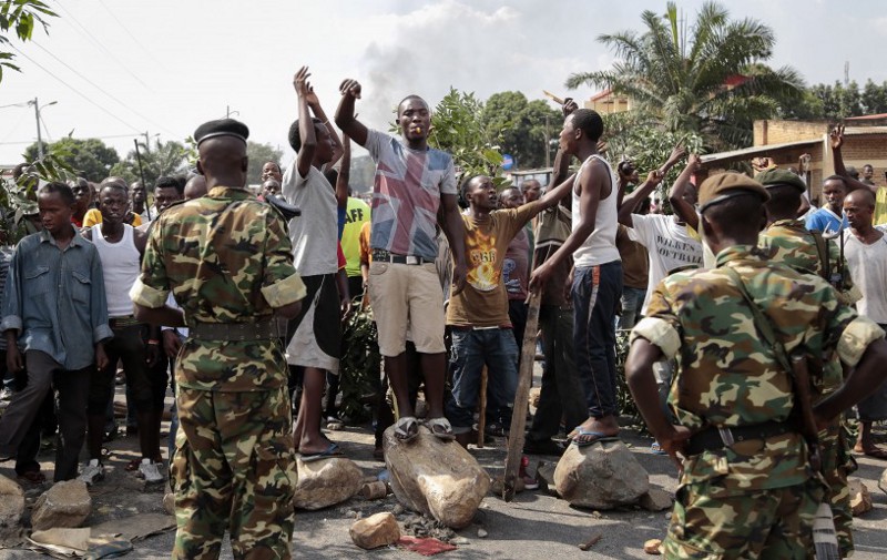 Opposition demonstrators confront army soldiers in the Mutarakura district, as security forces try to prevent people moving out of their neighborhoods, in the capital Bujumbura, Burundi Wednesday, May 27, 2015. CREDIT: AP Photo/Gildas Ngingo
