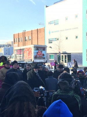 A pastor speaks in front of the Thursday protest in front of Two Rivers Charter School. CREDIT: Alex Zielinski