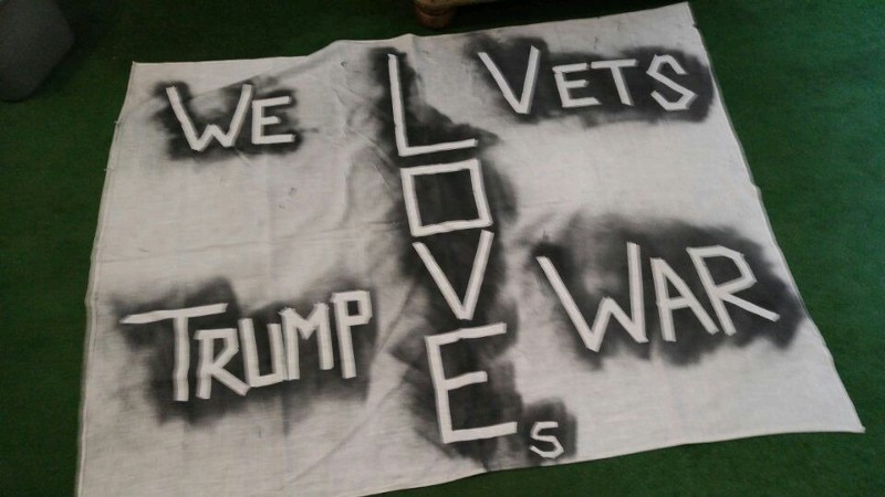 Protestors at Donald Trump’s rally for veterans wanted to hold up this sign, but were escorted out by security before they could hold it up. CREDIT: PHOTO COURTESY KENIA ALEJANDRA CALDERON