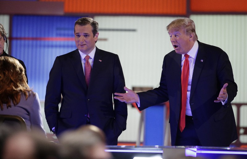 Republican presidential candidate, businessman Donald Trump speaks with the moderators as Republican presidential candidate, Sen. Ted Cruz, R-Texas, looks on during the Fox Business Network Republican presidential debate at the North Charleston Coliseum, Thursday, Jan. 14, 2016, in North Charleston, S.C. CREDIT: P PHOTO/CHUCK BURTON
