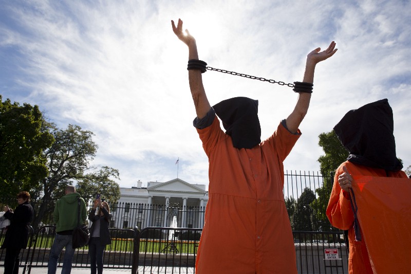 People protest against “indefinite detentions” at Guantanamo Bay detention center and Bagram prison, while in front of the White House. CREDIT: AP PHOTO/JACQUELYN MARTIN
