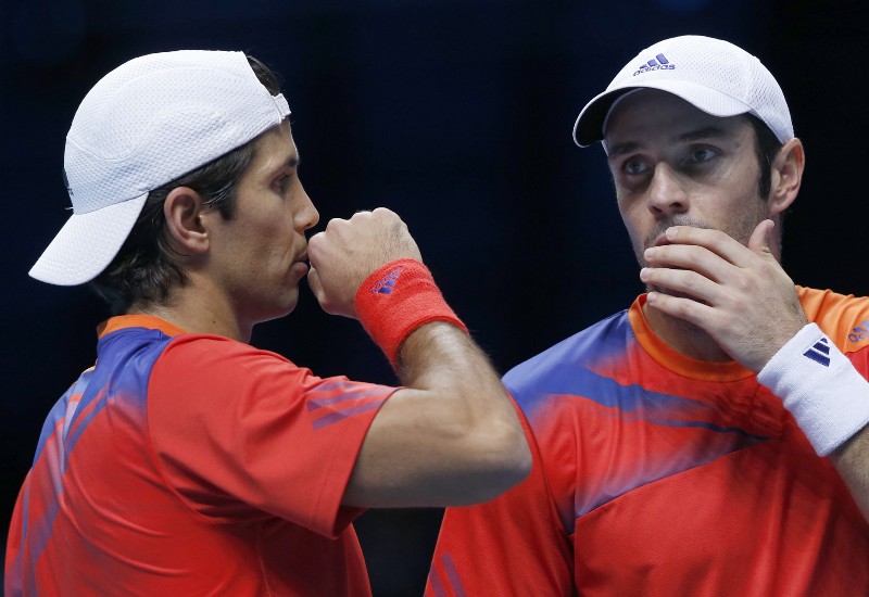 David Marrero of Spain, left, speaks to Fernando Verdasco of Spain at the O2 Arena in London, Monday, Nov. 11, 2013. CREDIT: SANG TAN, AP