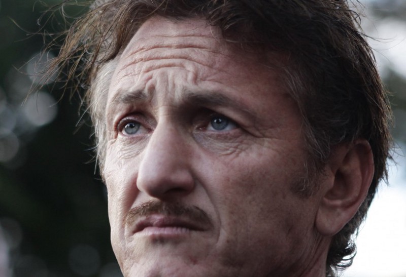 Actor Sean Penn listens to Venezuela’s President Hugo Chavez during a visit to the presidential palace in Caracas, Venezuela, Thursday, Feb. 16, 2012. CREDIT: AP Photo/Ariana Cubillos