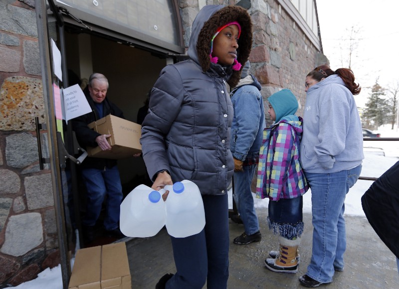 Flint resident Genetha Campbell gets free water CREDIT: AP PHOTO/PAUL SANCYA