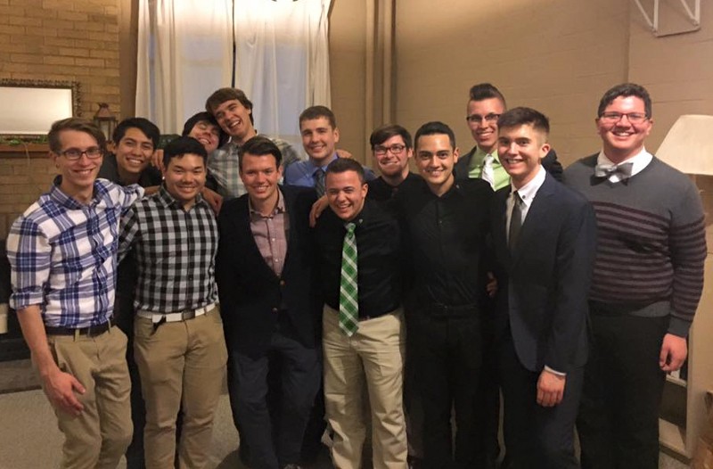 Sean Finn (center) and his Delta Lambda Phi fraternity brothers. CREDIT: COURTESY OF SEANĀ FINN