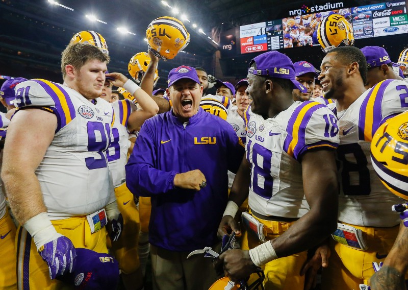 LSU head coach Les Miles celebrates with team after defeating Texas Tech in the Texas Bowl NCAA football game Wednesday, Dec. 30, 2015. CREDIT: BOB LEVEY, AP