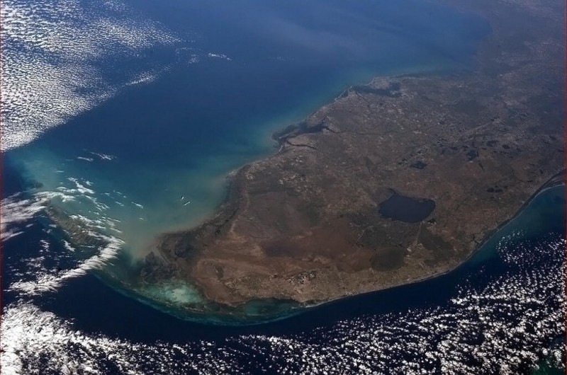 Lake Okeechobee can be seen from space. This massive dumping ground for chemicals and fertilizers is about to pollute Florida’s coastal communities. CREDIT: NASA, via Wikimedia Commons