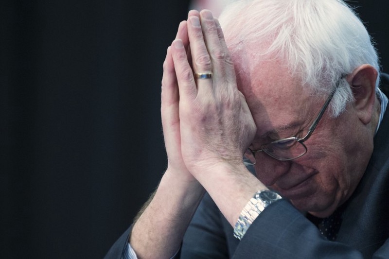 Democratic presidential candidate, Sen. Bernie Sanders, I-Vt. bows his head during a prayer at a breakfast with faith leaders at Allen University. CREDIT: AP Photo/Evan Vucci