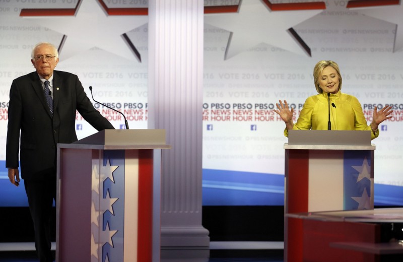 Democratic presidential candidate, Hillary Clinton makes a point as Sen. Bernie Sanders, I-Vt, reacts during a Democratic presidential primary debate at the University of Wisconsin-Milwaukee, Thursday, Feb. 11, 2016, in Milwaukee. CREDIT: AP PHOTO/MORRY GASH