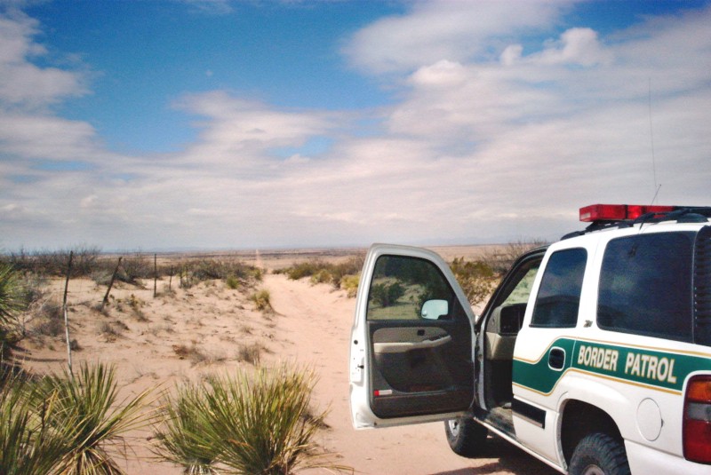 U.S. Border Patrol agents patrol a road that runs along the international border with Mexico east of Columbus, N.M., Saturday, April 3, 2004. New Mexico shares some 180 miles of border with Mexico, much of it marked by just a few strands of barbed wire and manned by a couple of cameras, some underground sensors and several hundred agents. (AP Photo/Leslie Hoffman) CREDIT: AP PHOTO/LESLIE HOFFMAN