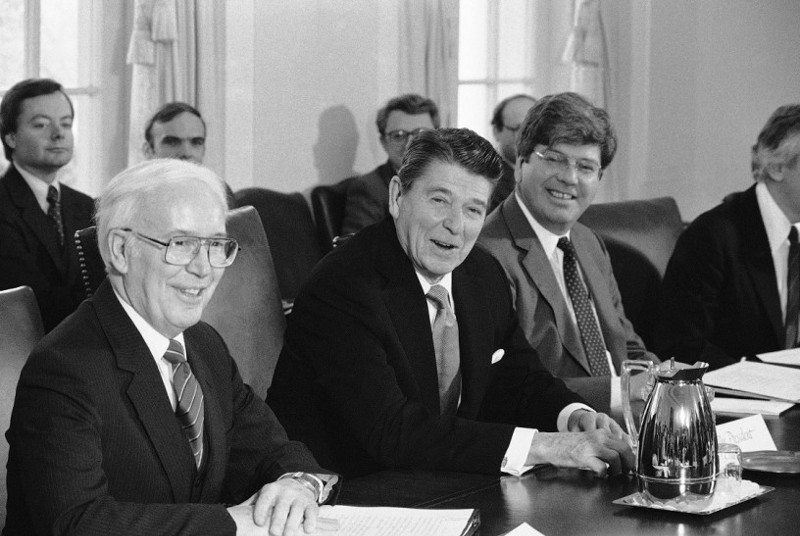 President Ronald Reagan is flanked by Education Secretary Terrel Bell, left, White House Policy director, during a meeting in the Cabinet Room in Washington, Feb. 23, 1984 where they discussed school discipline. (AP Photo) CREDIT: Anonymous, AP
