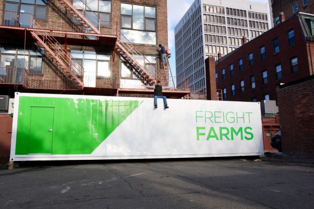 Michael Bissanti sits atop his Freight Farm behind his restaurant in Cambridge, MA. CREDIT: Michael Bissanti