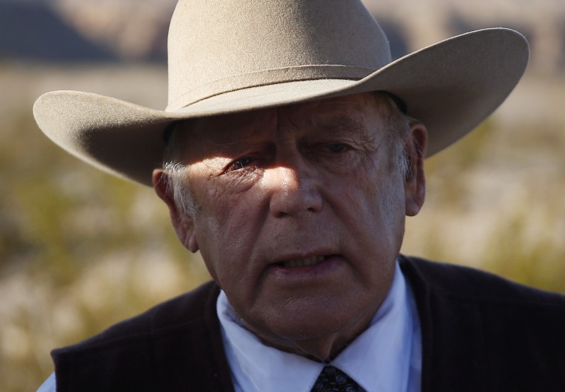 Rancher Cliven Bundy speaks to media while standing along the road near his ranch Wednesday, Jan. 27, 2016, in Bunkerville, Nev. CREDIT: AP PHOTO/JOHN LOCHER
