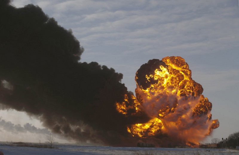 A fireball goes up at the site of an oil train derailment near Casselton, N.D. Dakota Access says exporting Bakken oil through a pipeline is safer than using trains and will release rail congestion for other commodities. CREDIT: AP Photo/Bruce Crummy