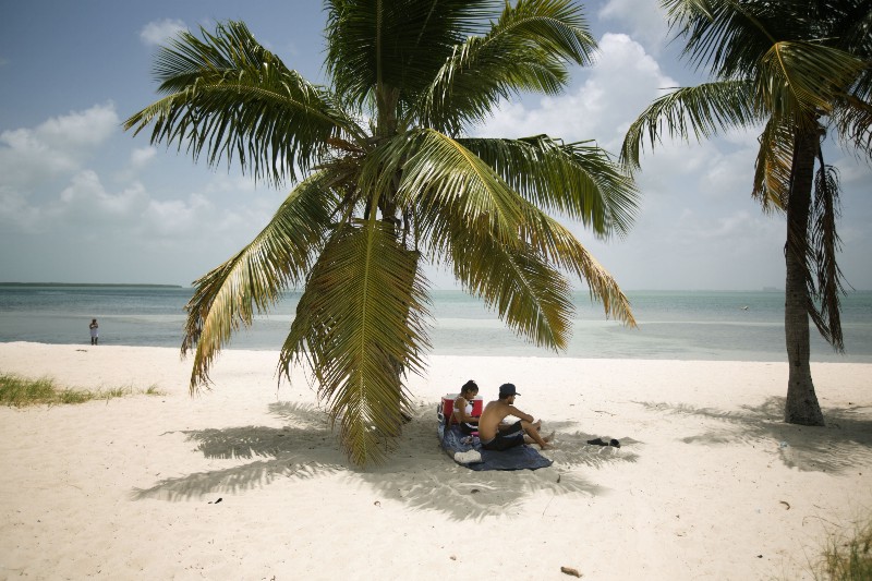 Sunbathers in Key Biscayne, Fla. CREDIT: AP PHOTO/J PAT CARTER