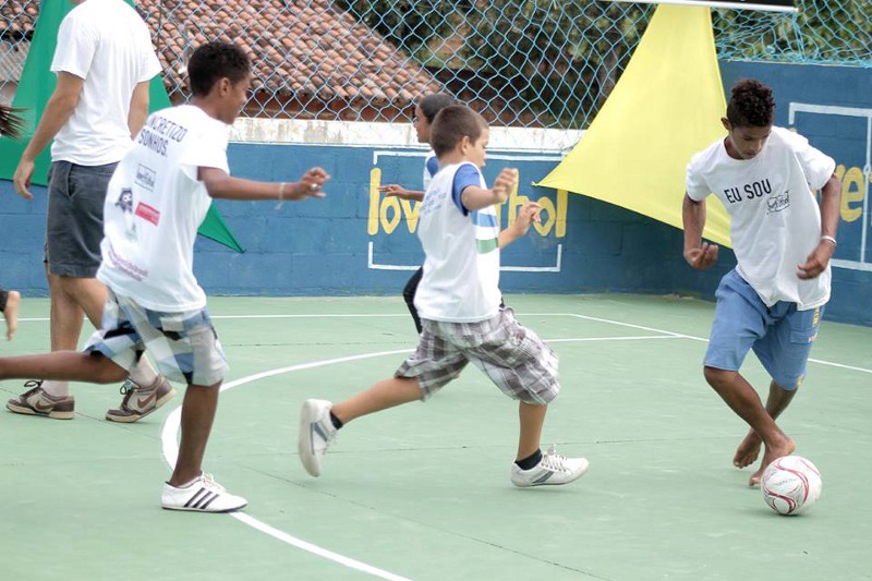 Children play soccer at the inauguration of the soccer pitch in Penedo de Cima, Brazil. CREDIT: COURTESY OF LOVE.FUTBOL