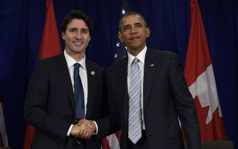 President Barack Obama, right, and Canada’s Prime Minister Justin Trudeau, left, stand to shake hands following their bilateral meeting at the Asia-Pacific Economic Cooperation summit in Manila, Philippines, in November. The two leaders announced major climate actions Thursday in advance of the Canadian leader’s first U.S. state dinner. CREDIT: AP PHOTO/SUSAN WALSH