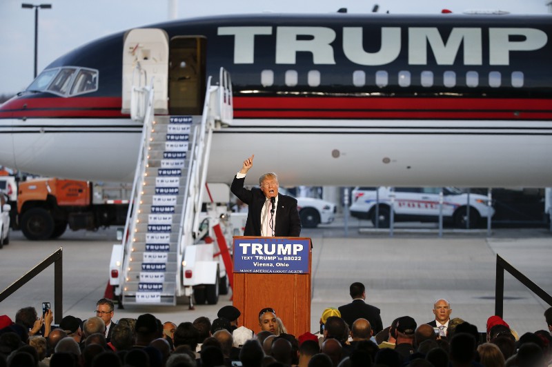 Republican presidential candidate, Donald Trump holds a plane-side rally in a hanger at Youngstown-Warren Regional Airport in Vienna, Ohio, Monday, March 14, 2016. CREDIT: AP PHOTO/GENE J. PUSKAR