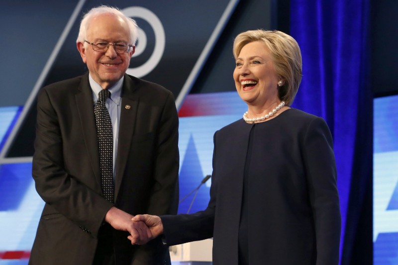 Democratic presidential candidates, Hillary Clinton and Sen. Bernie Sanders, I-Vt, shake hands before the start of the Univision, Washington Post Democratic presidential debate in Miami, Fla. CREDIT: AP PHOTO, WILFREDO LEE