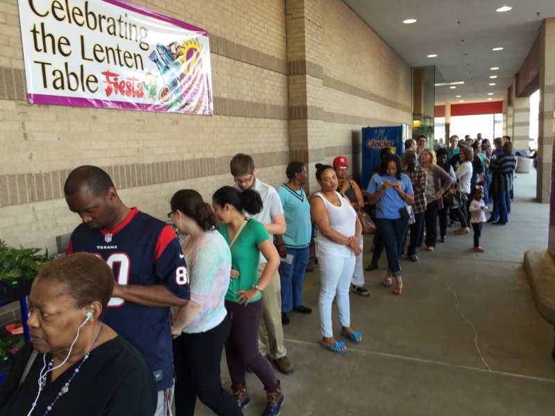 Voters line up outside Fiesta Mart in southwest Houston, Texas on Super Tuesday. CREDIT: EMILY ATKIN