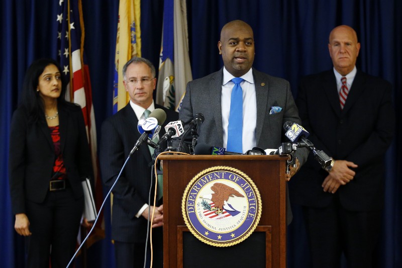 Newark Mayor Ras Baraka, front, stands with Vanita Gupta, left, principal deputy assistant attorney general for the U.S. Department of Justice Civil Rights Division, Paul Fishman, second from left, U.S. attorney for the District of New Jersey, and Anthony Ambrose, right, Newark public safety director, while speaking during a news conference, CREDIT: AP PHOTO/JULIO CORTEZ