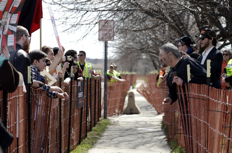 Protesters argue with a supporter outside the Holiday Inn Express during protest Republican presidential candidate Donald Trump’s appearance scheduled Tuesday at the adjoining conference center Tuesday, March 29, 2016, in Janesville, Wis. CREDIT: AP PHOTO/NAM Y. HUH