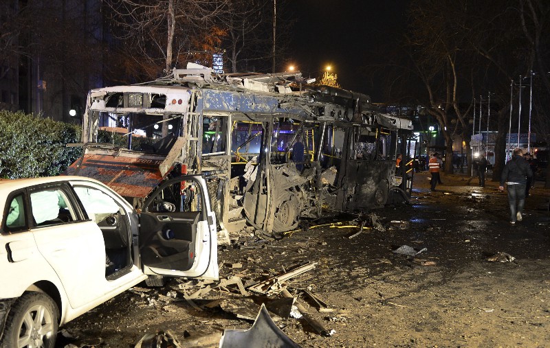 Damaged vehicles are seen at the scene of an explosion in Ankara, Turkey, Sunday, March 13, 2016. CREDIT: SELAHATTIN SONMEZ/HURRIYET DAILY VIA AP, TURKEY OUT
