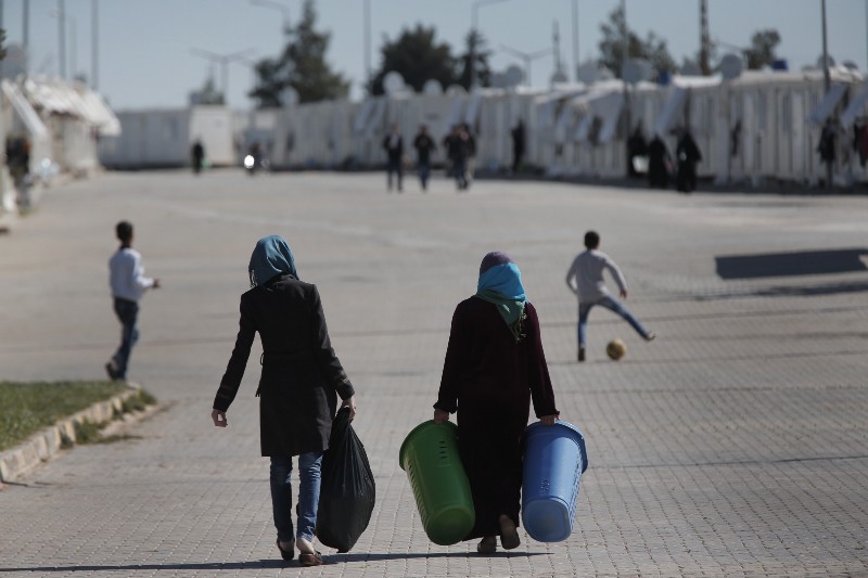 Syrian refugees go about their normal lives at the Oncupinar refugee camp for Syrian refugees next to the border crossing with Syria, near the town of Kilis in southeastern Turkey, Thursday, March 17, 2016. The European Union and Turkey hope to reach a comprehensive deal this week to tackle illegal migration and the refugee crisis spurred by conflicts in Syria and beyond. (AP Photo/Lefteris Pitarakis) CREDIT: AP PHOTO/LEFTERIS PITARAKIS