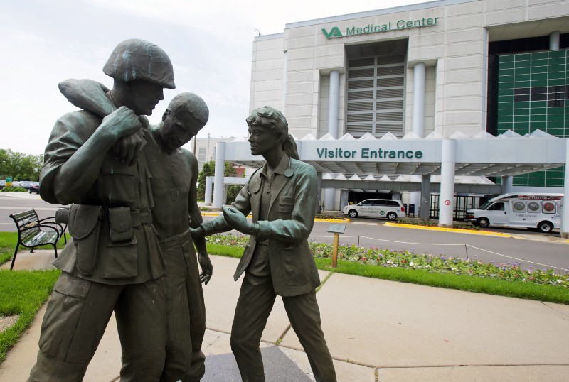 A sculpture portraying a wounded soldier being helped on the grounds of the Minneapolis VA Hospital. CREDIT: AP PHOTO, JIM MONE