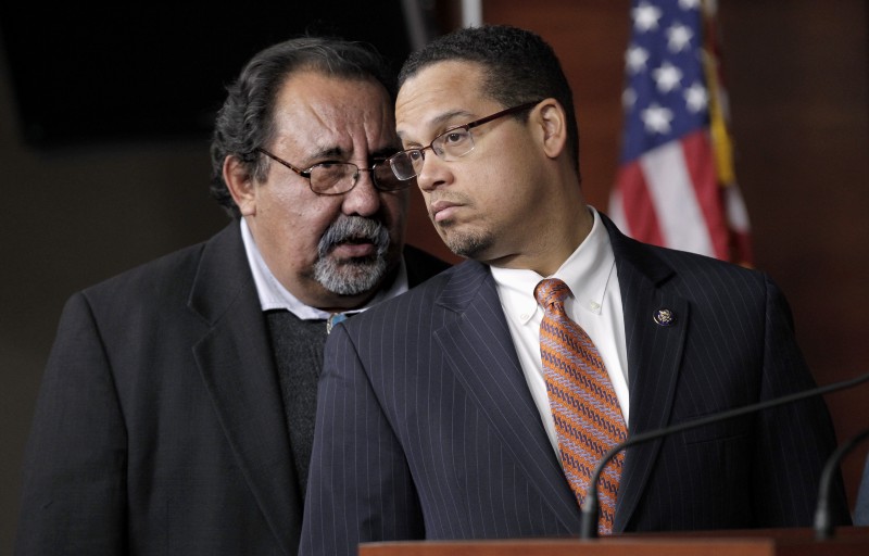 Rep. Keith Ellison, D-Minn., right, and Rep. Raul Grijalva, D-Ariz., left, co-chairs of the Congressional Progressive Caucus, confer during a news conference on Capitol Hill in Washington, Tuesday, Dec. 13, 2011, to discuss jobs. CREDIT: AP PHOTO/J. SCOTT APPLEWHITE