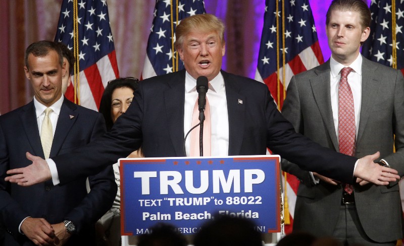 With his campaign manager Corey Lewandowski at his left, Republican presidential candidate Donald Trump speaks to supporters at his primary election night event at his Mar-a-Lago Club in Palm Beach, Fla., Tuesday, March 15, 2016. CREDIT: AP PHOTO/GERALD HERBERT
